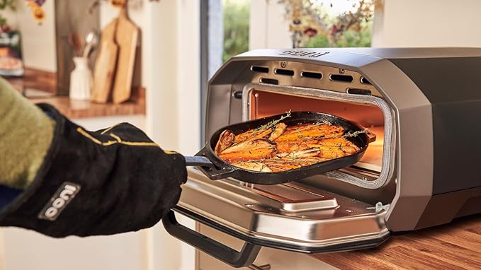 ooni Cast Iron Sizzler Pan - Griddle Frying Pan, 12" x 6" Sizzler Plate with Removable Handle and Stainless Steel Trivet, Pre-Seasoned Non-Stick Oven Safe Cookware, Pizza Oven and BBQ Accessories