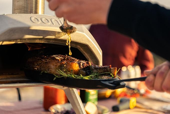 ooni Cast Iron Sizzler Pan - Griddle Frying Pan, 12" x 6" Sizzler Plate with Removable Handle and Stainless Steel Trivet, Pre-Seasoned Non-Stick Oven Safe Cookware, Pizza Oven and BBQ Accessories