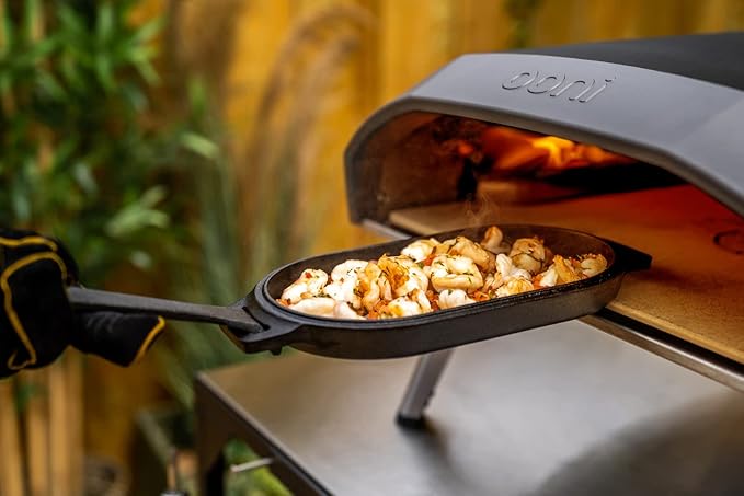 ooni Cast Iron Sizzler Pan - Griddle Frying Pan, 12" x 6" Sizzler Plate with Removable Handle and Stainless Steel Trivet, Pre-Seasoned Non-Stick Oven Safe Cookware, Pizza Oven and BBQ Accessories