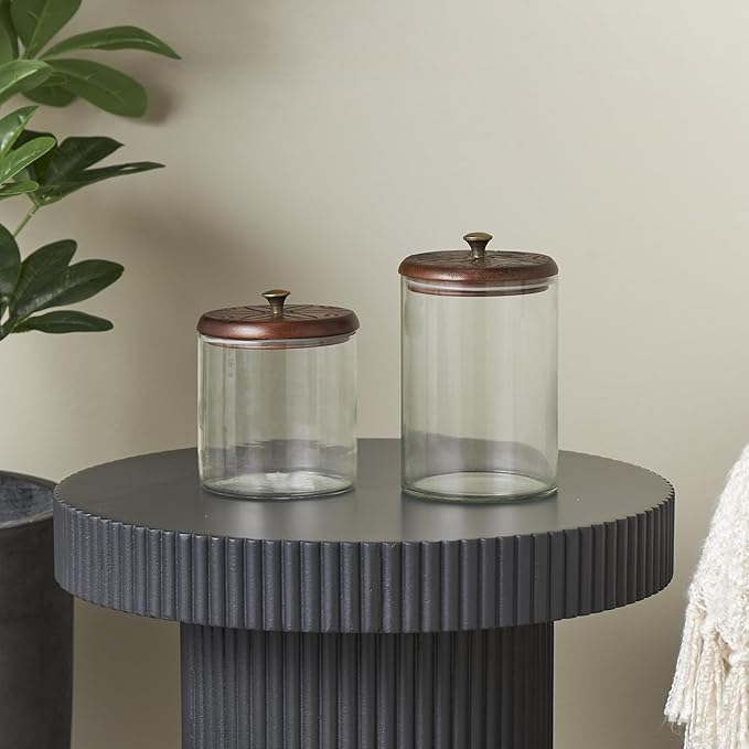 Deco 79 Glass Floral Living Room Decorative Jars Carved Decorative Container with Brown Wooden Lids and Gold Knobs, Set of 2 Jar with Lid 9", 6"H, Clear