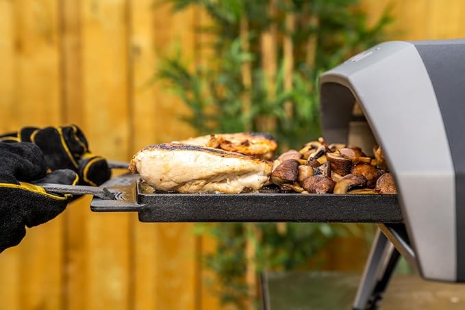 ooni Cast Iron Dual-Sided Grizzler Plate - 13.6" x 12.5" Reversible Griddle with Removable Handle and Stainless Steel Trivet, Pre-Seasoned Non-Stick Oven Safe Cookware, Pizza Oven and BBQ Accessories