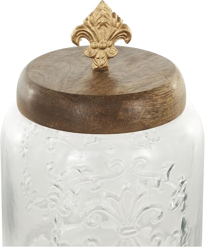 Deco 79 Glass Scroll Living Room Decorative Jars Decorative Container with Brown Wooden Lids and Gold Fleur-De- Lis Knobs, Set of 2 Jar with Lid 9", 7"H, Clear