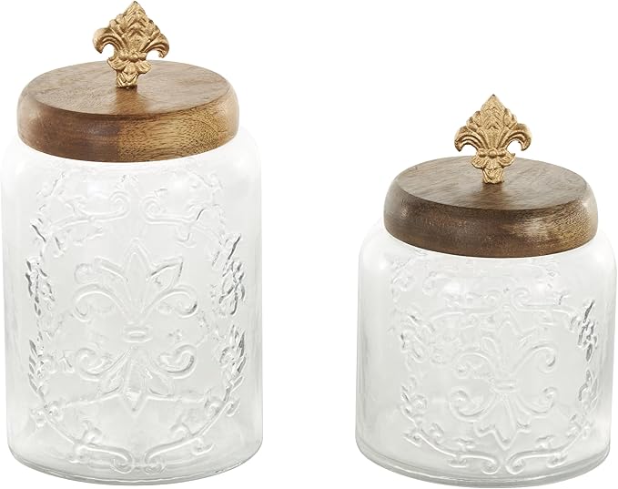 Deco 79 Glass Scroll Living Room Decorative Jars Decorative Container with Brown Wooden Lids and Gold Fleur-De- Lis Knobs, Set of 2 Jar with Lid 9", 7"H, Clear