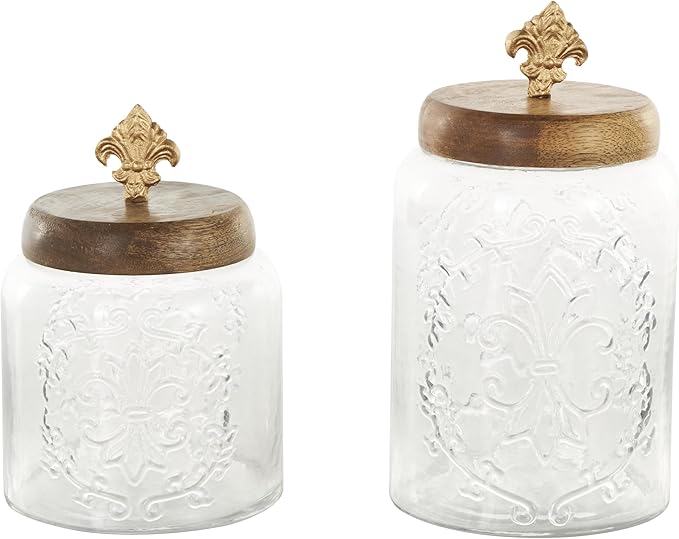 Deco 79 Glass Scroll Living Room Decorative Jars Decorative Container with Brown Wooden Lids and Gold Fleur-De- Lis Knobs, Set of 2 Jar with Lid 9", 7"H, Clear