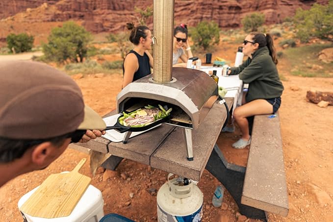 ooni Cast Iron Sizzler Pan - Griddle Frying Pan, 12" x 6" Sizzler Plate with Removable Handle and Stainless Steel Trivet, Pre-Seasoned Non-Stick Oven Safe Cookware, Pizza Oven and BBQ Accessories