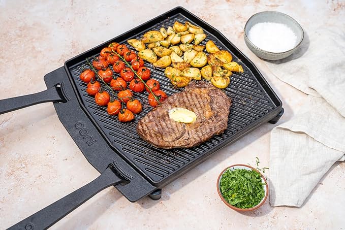 ooni Cast Iron Dual-Sided Grizzler Plate - 13.6" x 12.5" Reversible Griddle with Removable Handle and Stainless Steel Trivet, Pre-Seasoned Non-Stick Oven Safe Cookware, Pizza Oven and BBQ Accessories